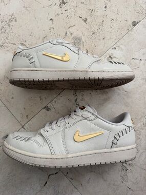 Nike Women’s Low-Top Sneakers in Light Cream with Gold Trim